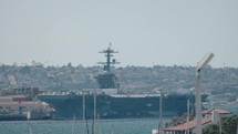 Military aircraft carrier in the harbour