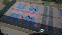 Aerial of senior citizens playing pickleball on a court