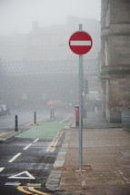 street sign on a foggy street in Glasgow 