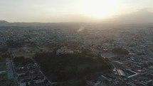 Panoramic drone shot View Over Puebla Municipality And Its Church During Sunrise In Mexico