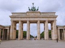 BERLIN, GERMANY - MAY 11, 2014: Tourists visiting the Brandenburger Tor (Brandenburg Gate) linking East and West Berlin
