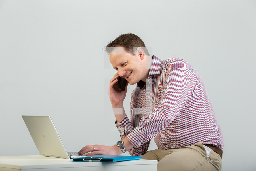 a man using a laptop computer 