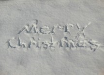 Merry Christmas written in snow.