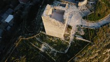 Overview of the Ancient Castle with Damaged Tower of a Vintage Town