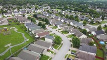 Aerial view of a neighborhood with a park
