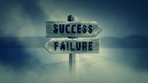 Old Wooden Sign on a Middle of a Cross Road With the Words Success or Failure