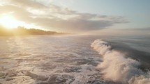 Surf Diving Under Wave Costa Rica Sunrise Ocean Drone Aerial