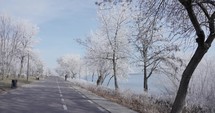 Empty Road During Winter Pass On Frozen Trees In Galati, Romania. POV	