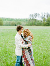 couple in love in a grass field 