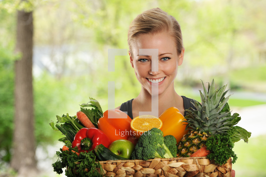 woman with a basket of fruits and vegetables 