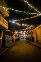 string of lights over an alley