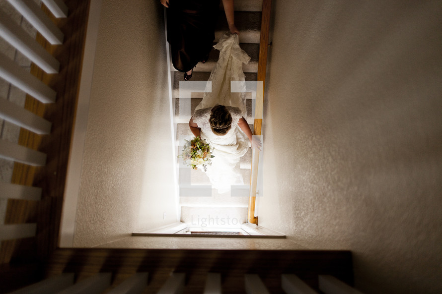 A bride walking down stairs