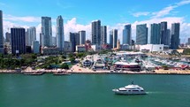 Drone Shot of Large Yacht and Downtown Miami Skyline on Sunny Clear Day. 