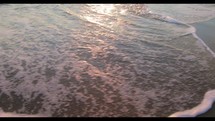 The Slowly Waves of Ocean After a Summer Sunset