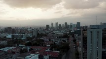 Aerial View Of Mexico City Skyline On a Cloudy Day - drone shot	