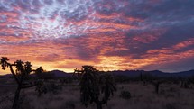 Timelapse of colorful clouds during a desert sunrise