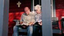a husband and wife read a Bible together 
