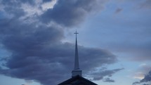 Time lapse of clouds beyond a church steeple