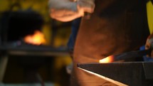 Blacksmith Banging a Hot Metal in a Workshop Slow Motion