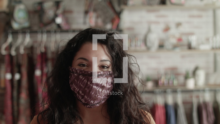 female at a boutique wearing a face mask 