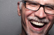 closeup of a smiling man's face 