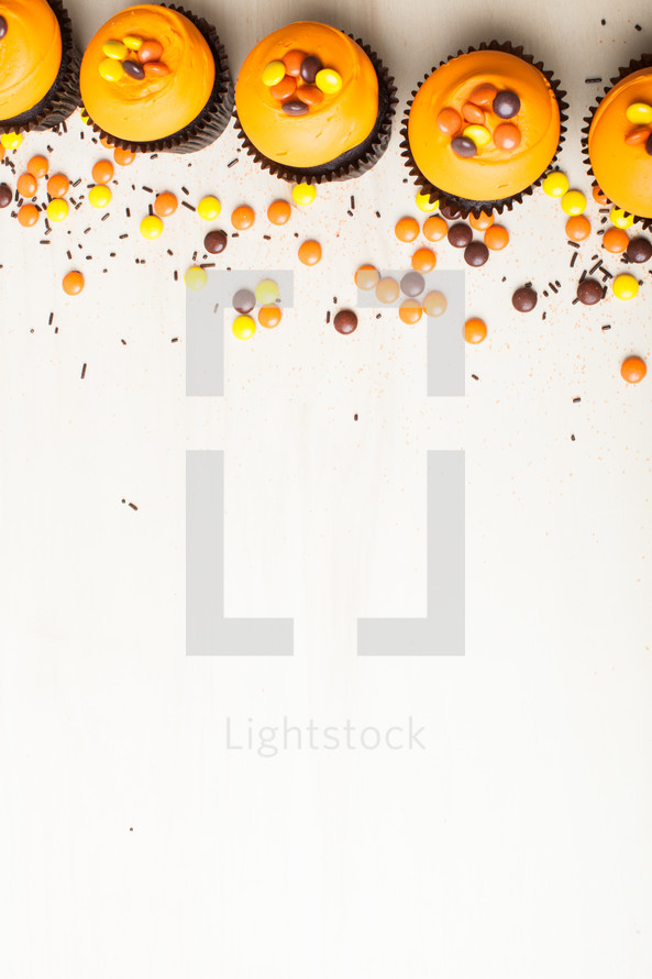 fall cupcakes border on a white background 
