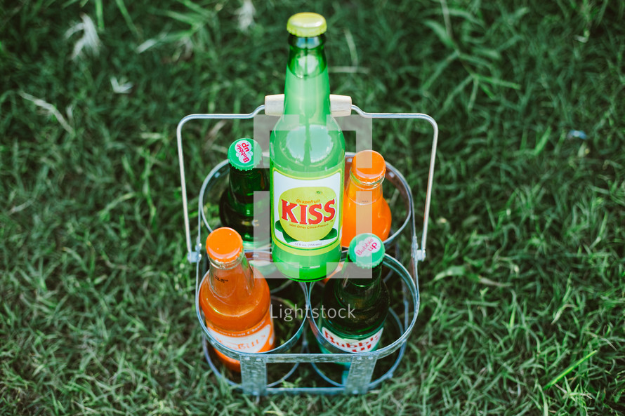 sodas in the grass