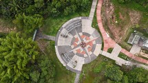 Aerial photo taken with drone of 8-point star in middle of park on cloudy afternoon