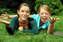 teen girls playing outdoors 