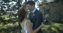 Happy couple, husband and wife, bride and groom kissing on wedding day.