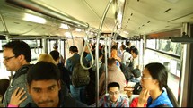 communters riding on a bus 