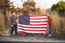 couple holding an American flag 