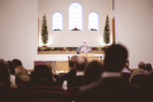 minister preaching at Christmas 