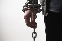 man bound in chains 