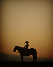silhouette of a cowboy on his horse 