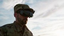 Concentrated military drone operator driving a drone