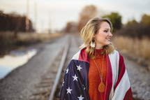 woman wrapped in an American flag 