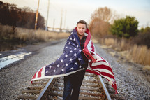 man wrapped in an American flag 
