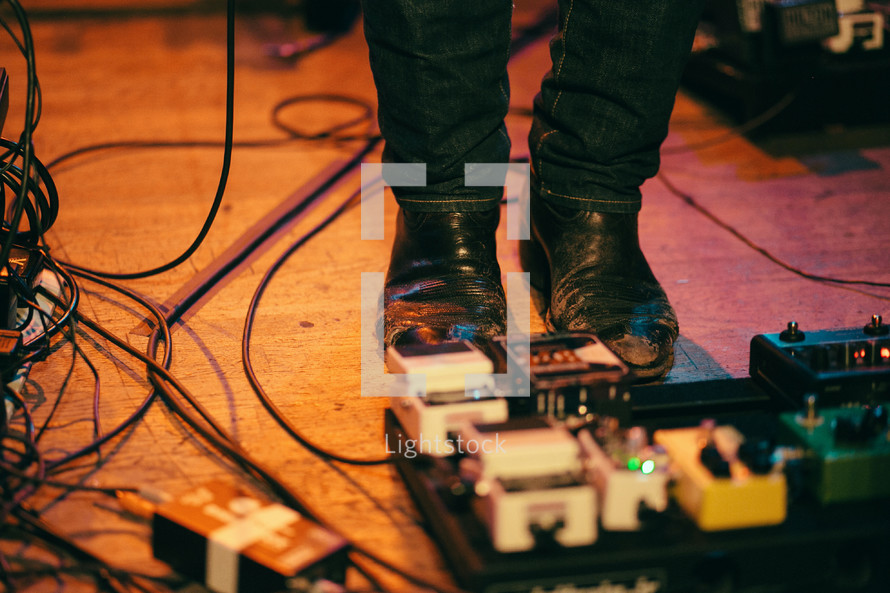 foot on guitar pedals 