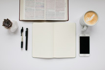 a desk with a border of items for a Bible study 