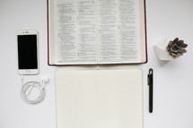 Bible and items on a desk 