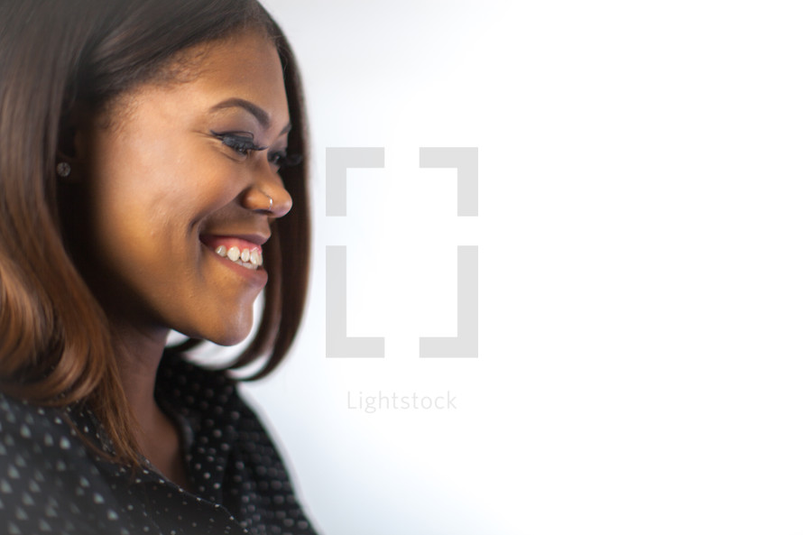 side profile of a smiling African American woman 