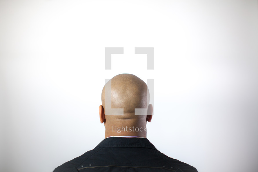 back of a man's bald head 