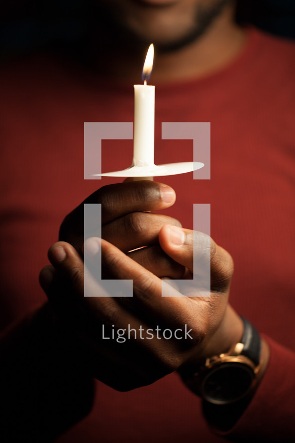 man, African American, holding, candle, Christmas Eve, Candlelight service, worship service 