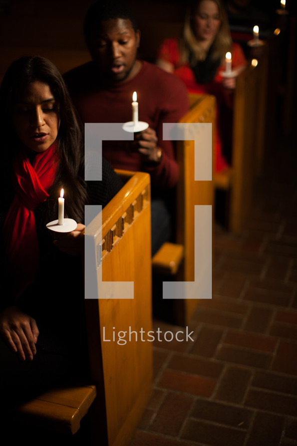 parishioners, congregation, worship service, standing, church, holding, candles, Christmas Eve, candlelight service, worship  