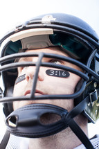 football player with John 3;16 on his face 
