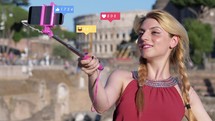 Girl taking selfies with a selfie stick.