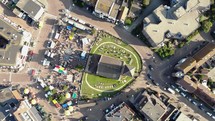 Reformed Church of Wijk aan Zee in the main square with the traditional market, in North Holland, the Netherlands - Rotating Bird's eye view