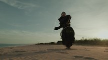 Monk Does Jump Rope Sport Cardio Training On The Soft Sand