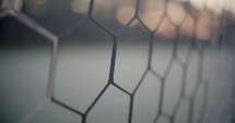 Soccer Net Macro Shot with Early Morning Sunrise